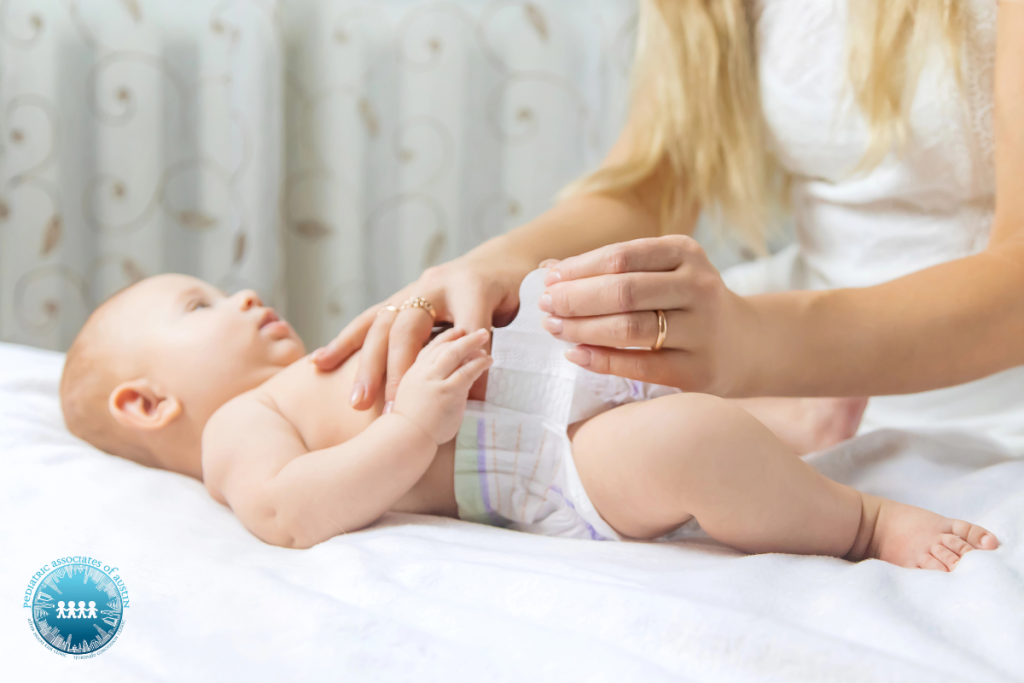 A mother changing her baby’s diaper in Texas.